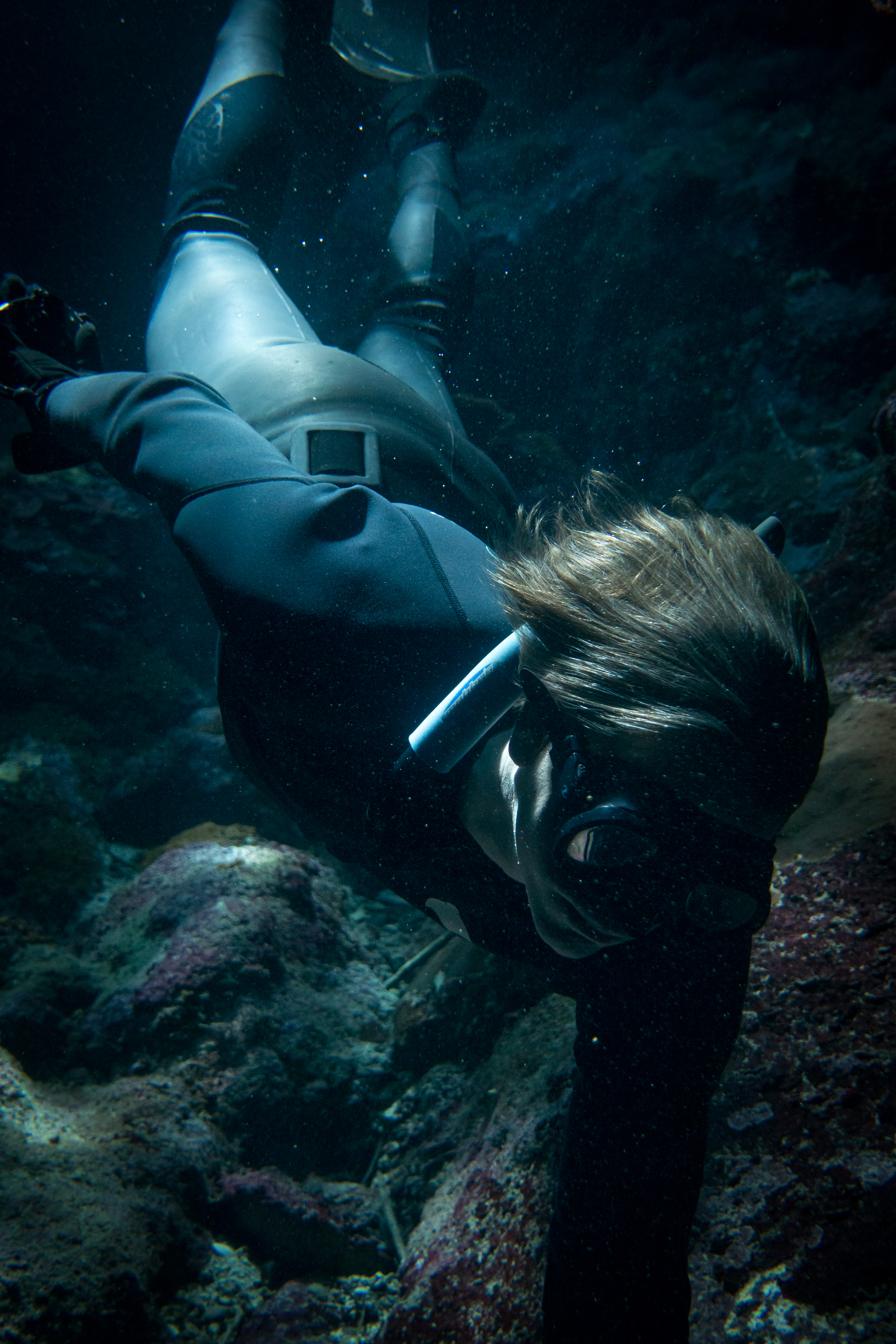 Marlon Quinn Freediving Rock Crevice by James Cini