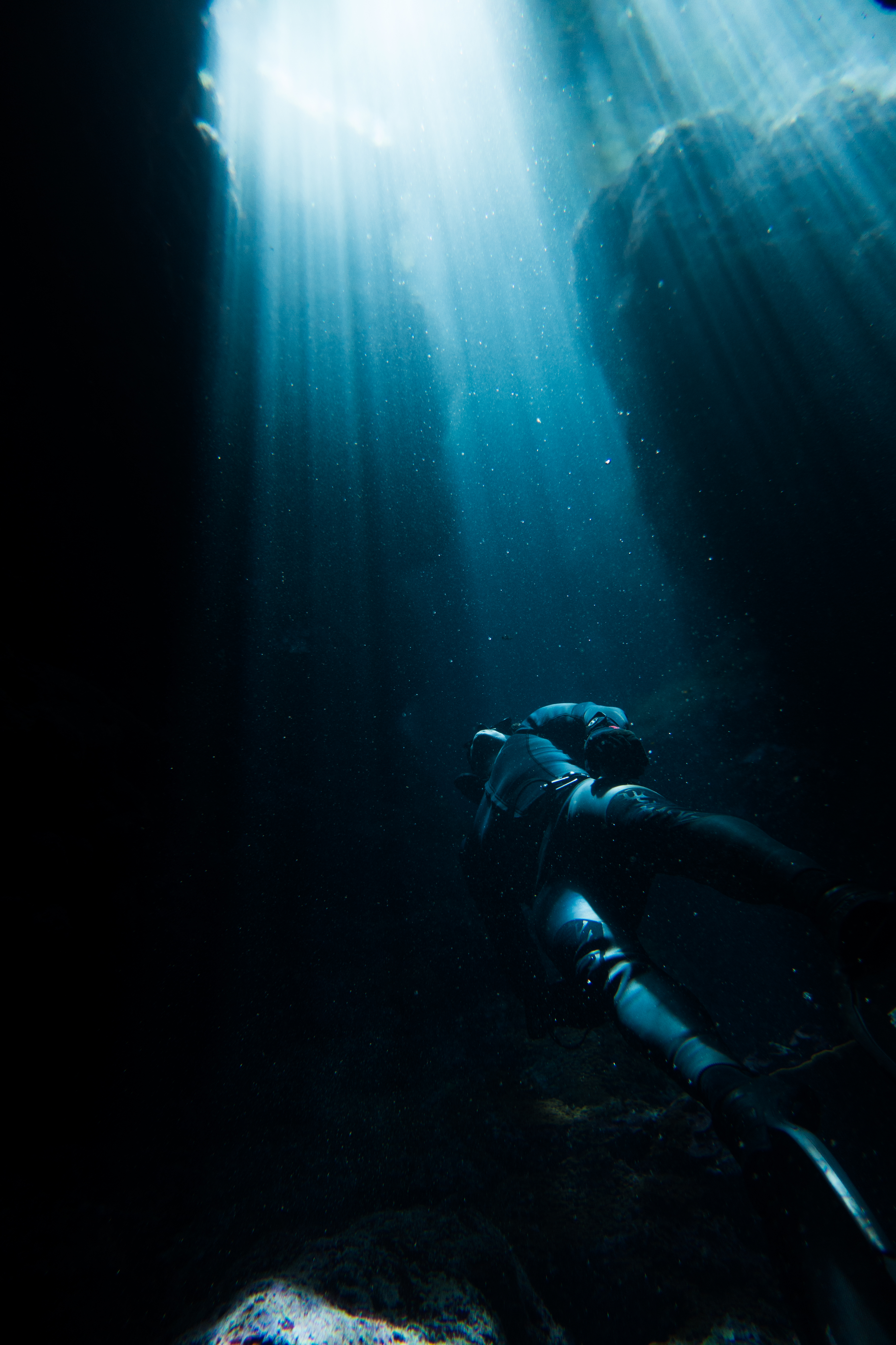 Marlon Quinn Freediving Rock Crevice by James Cini